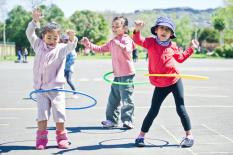 Young girls hula-hooping